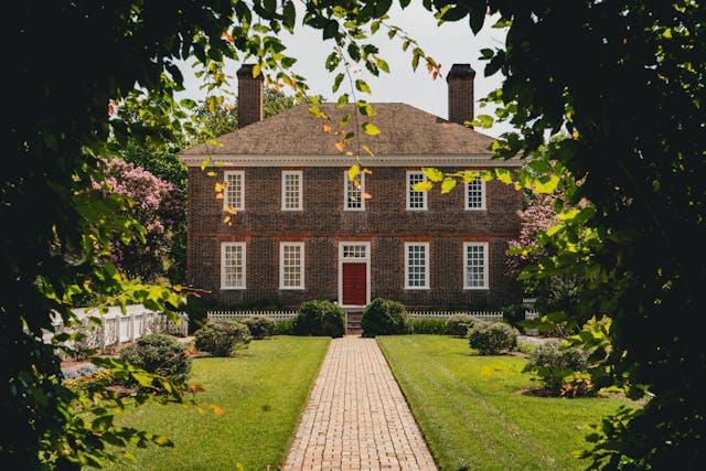 Discover Virginia's best-kept secrets for relocation, featuring charming brick houses with spacious front yards.