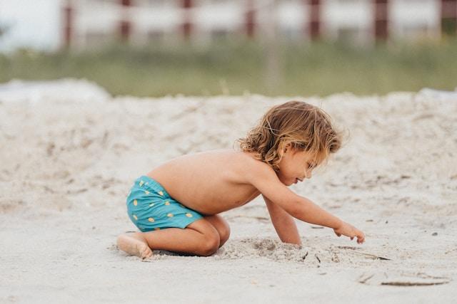Child playing at a beach